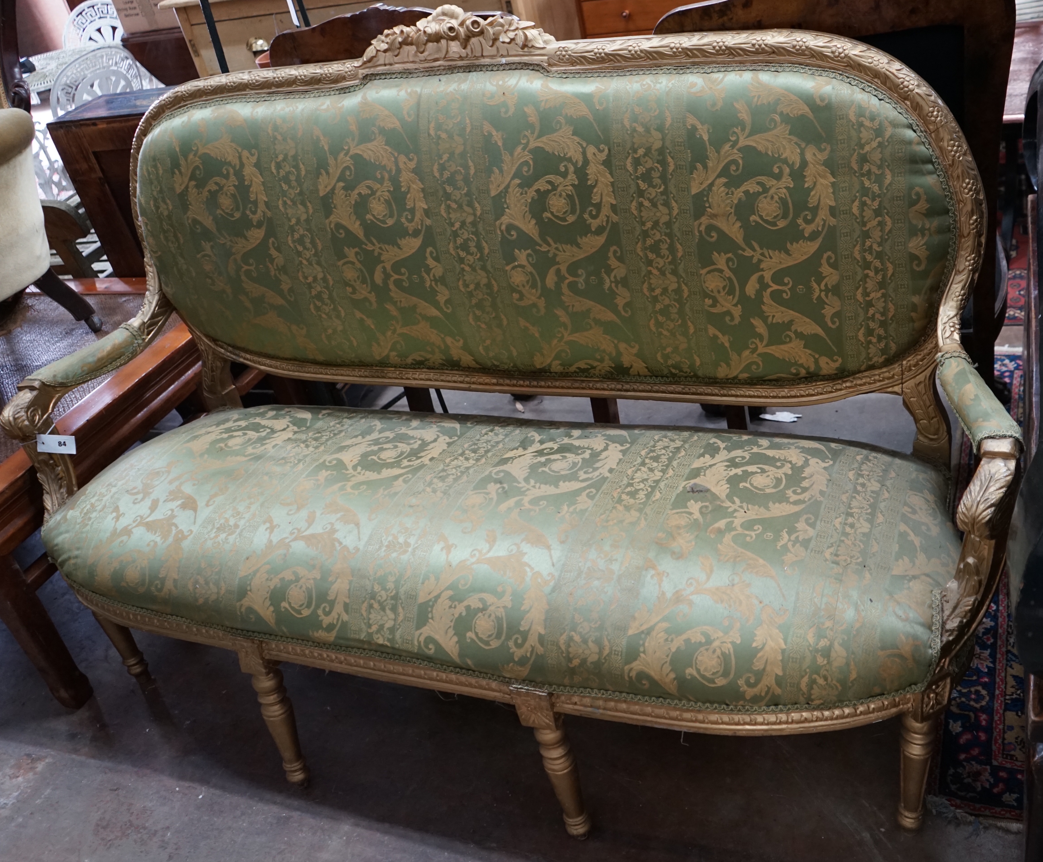 A late 19th century French carved giltwood settee, width 178cm depth 56cm height 114cm